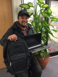 Garrett holding laptop