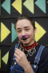 Junix holding a flower, smiling