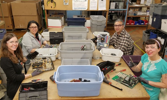 Volunteers working on computer