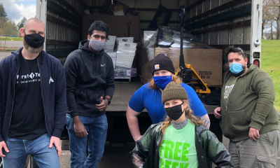 free geek staff in front of pickup truck